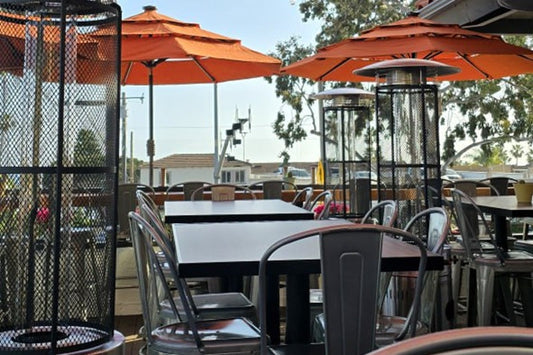 Best Place to Grab a Bite to Eat in San Clemente Tables, Chairs, Umbrellas and Outdoor Heaters on the Patio Area of Chelas Mexican Kitchen